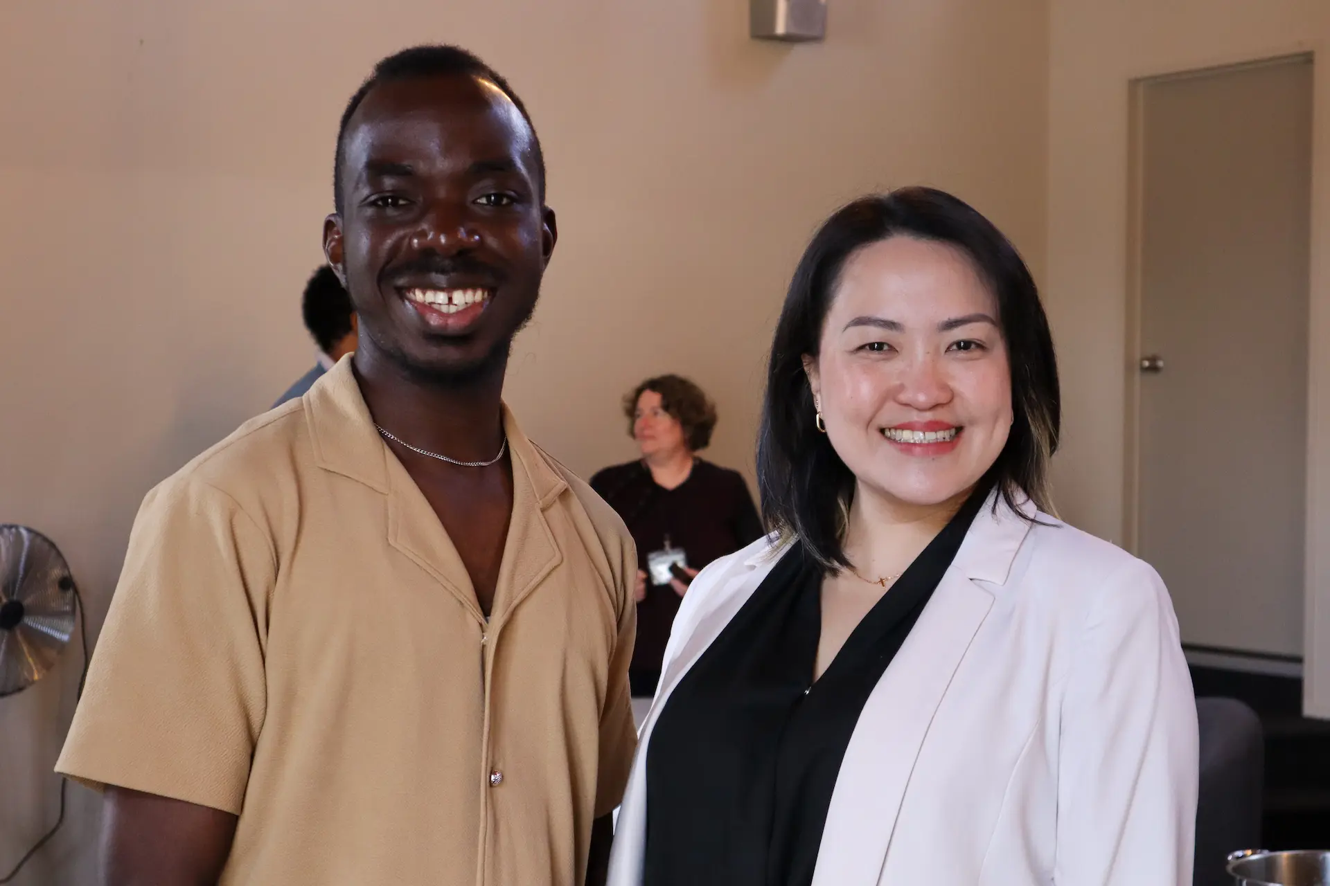 A man and woman staring candidly at the camera.