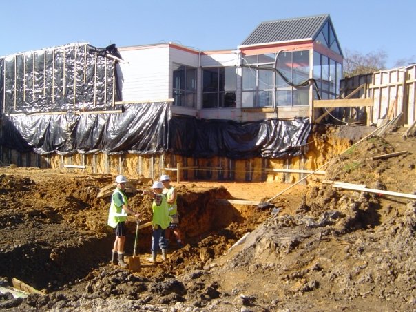 Two men conversing while on a construction site during the new construction of Glenfield Baptist Church's hall.