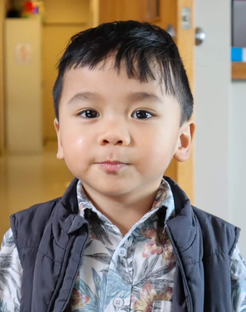 A young Filipino toddler staring at the camera.