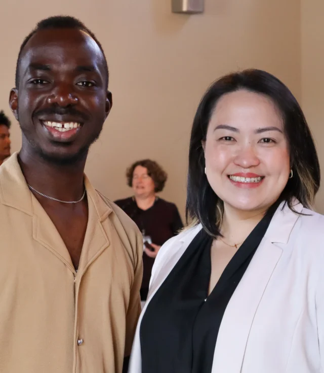 A man and woman staring candidly at the camera.