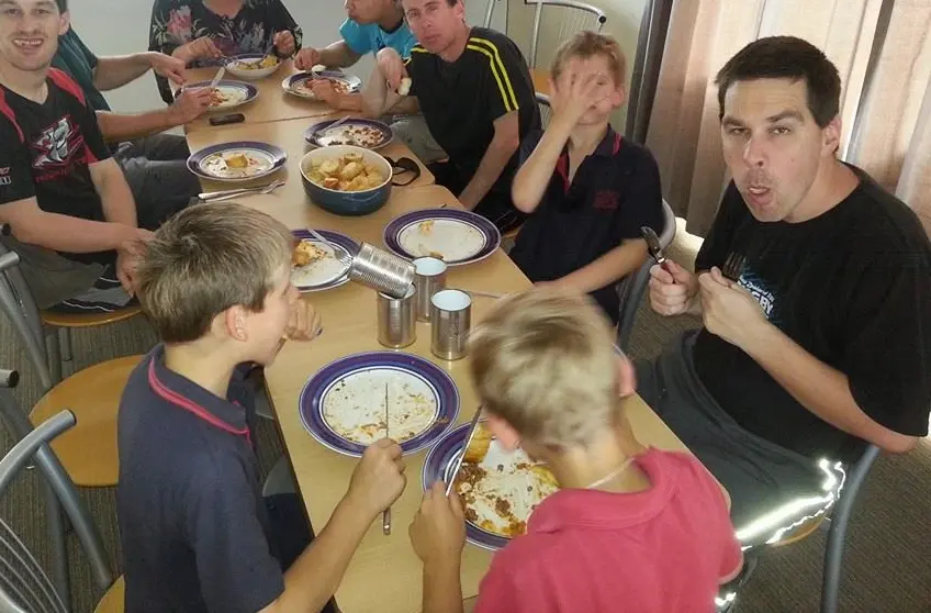 A group of people eating dinner together.